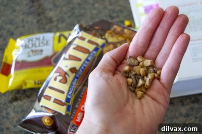 Toffee chips being added to brownie batter