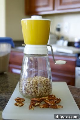 A batch of freshly baked Nut Cookies, golden-brown with visible nut pieces, arranged on a cooling rack.
