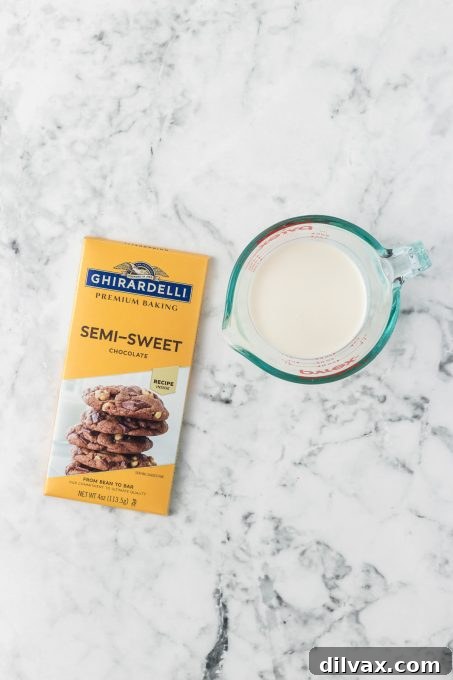 Ingredients for the rich chocolate ganache topping of Buckeye Cookies, including heavy cream and finely chopped chocolate.