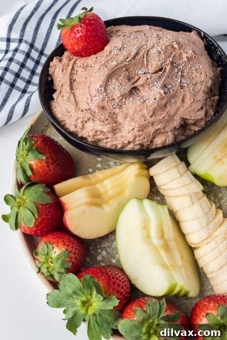 Luscious Chocolate Peanut Butter Fruit Dip 7 Close-up of creamy chocolate cheesecake fruit dip in a bowl.