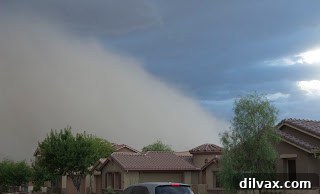 A closer view of the haboob, the dust cloud growing taller and wider