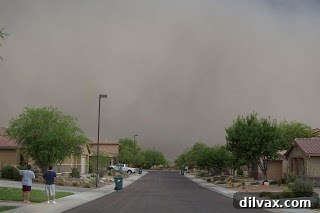 The haboob engulfing residential areas, blurring the skyline