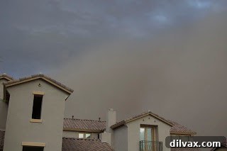 Deep orange and brown colors dominate the sky as the dust storm intensifies