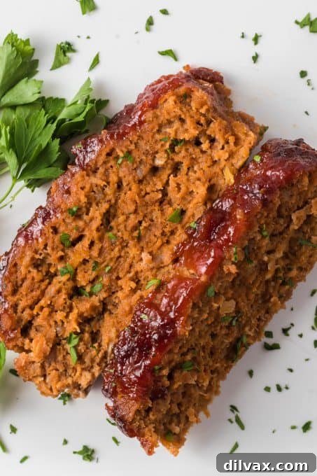 A sweet mustard and ketchup glaze top a loaf made of beef, veal and pork.