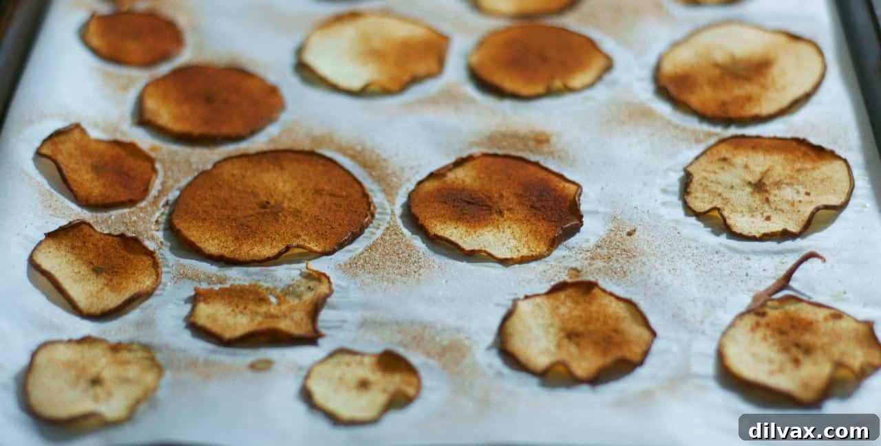 A variety of baked cinnamon pear slices arranged artfully.