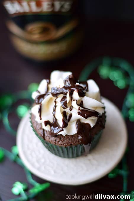 Cupcakes infused with Bailey's Irish Cream, topped with generous frosting.
