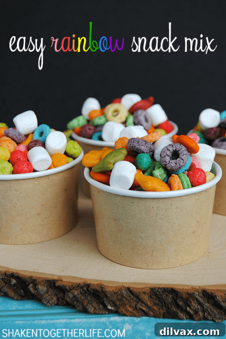 A colorful rainbow snack mix in a bowl, perfect for a St. Patrick's Day party.