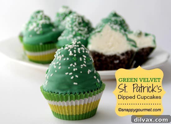 Green velvet cupcakes dipped in white chocolate and decorated with festive sprinkles.