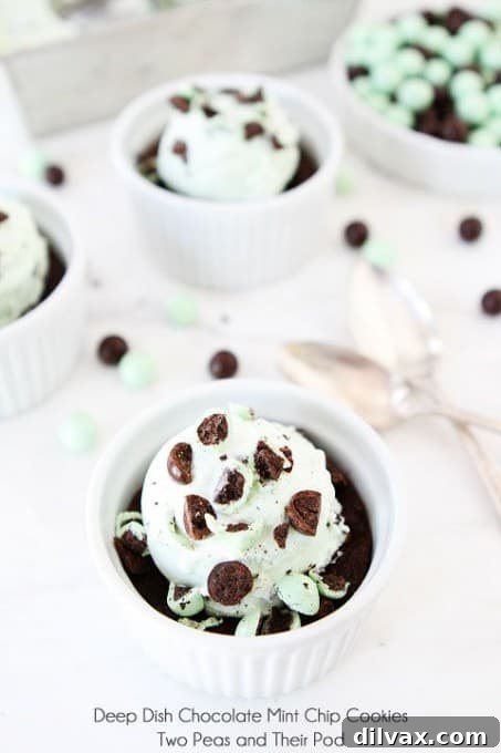 Warm, gooey deep-dish chocolate mint cookies with melty chocolate chips and mint pieces.