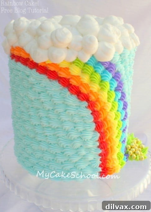 A cake decorated with a beautiful St. Patrick's Day rainbow buttercream design.