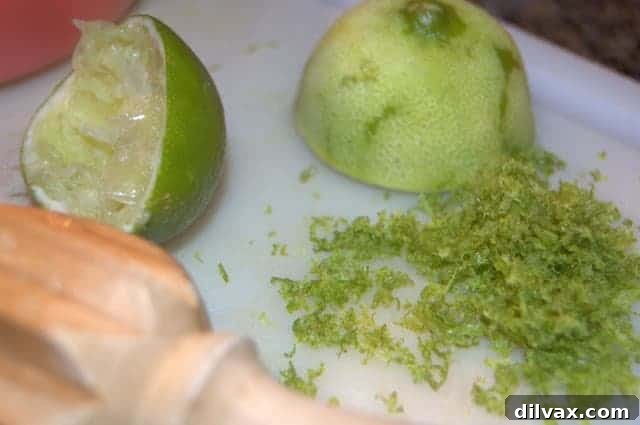 A close-up of delicious Chewy Lime Coconut Sugar Cookies with a recipe card.