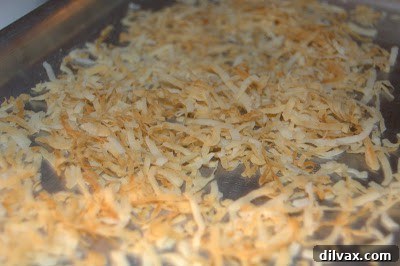 Lime Coconut Sugar Cookies cooling on a wire rack, showcasing their chewy texture.