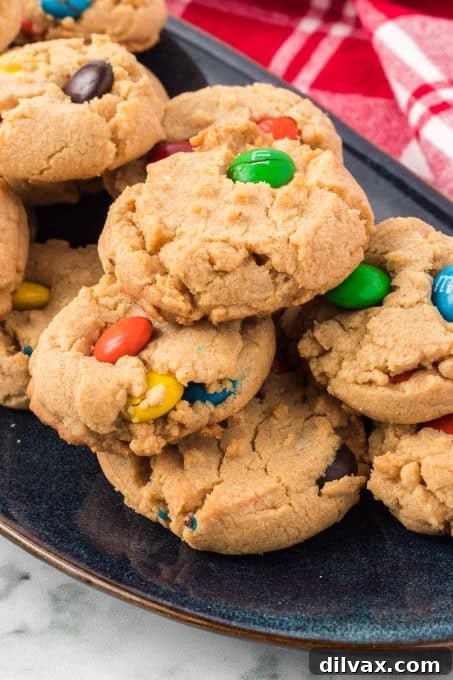 Ultimate Peanut Butter M&M Cookies 9 Peanut butter cookies filled with M&M candies.