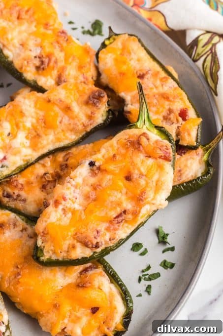 Touchdown Treats: 33 Effortless Game Day Recipes 25 Crispy bacon-wrapped Jalapeno Poppers filled with cheese.