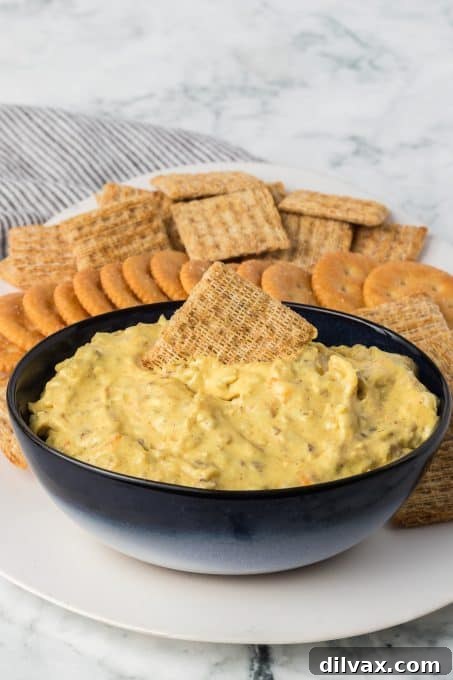 Touchdown Treats: 33 Effortless Game Day Recipes 9 A delicious and vibrant Curry Dip with fresh vegetables.