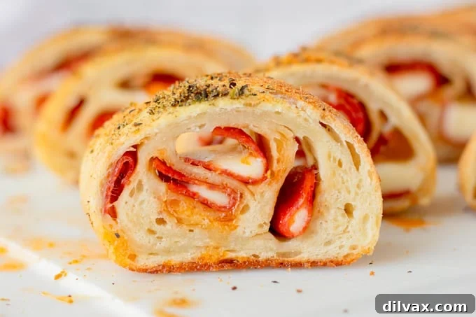 Touchdown Treats: 33 Effortless Game Day Recipes 28 A loaf of freshly baked Pepperoni Bread, sliced for serving.