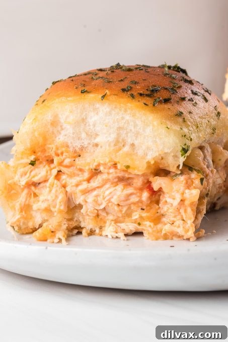 Touchdown Treats: 33 Effortless Game Day Recipes 16 Flavorful Buffalo Chicken Sliders on sweet Hawaiian rolls.