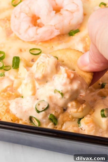 Touchdown Treats: 33 Effortless Game Day Recipes 12 A creamy and flavorful Shrimp Dip in a bowl with crackers.