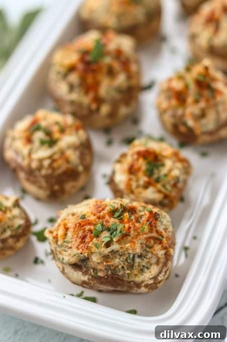 Touchdown Treats: 33 Effortless Game Day Recipes 19 Delicious Stuffed Mushrooms with Cream Cheese, ready to serve.