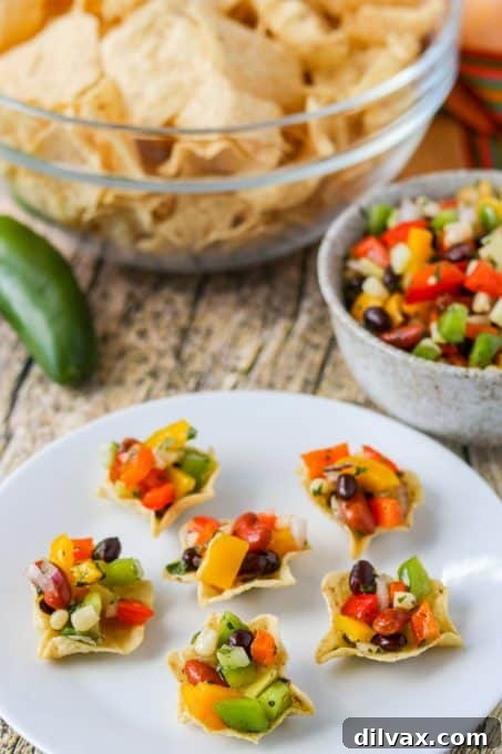 Touchdown Treats: 33 Effortless Game Day Recipes 21 Tortilla scoops filled with a colorful and easy Texas Caviar appetizer.