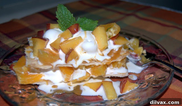 Finished Orange Peach Faux Napoleon dessert, layered with ice cream and caramel sauce