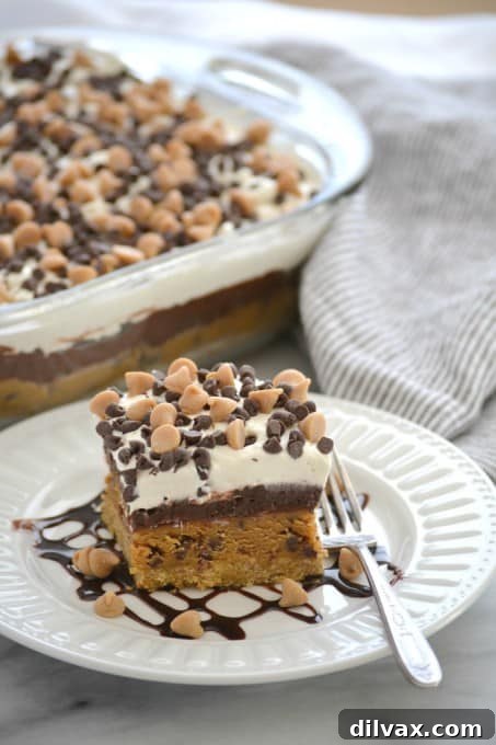 Peanut Butter Cookie Dough Dream Bars topped with mini chocolate and peanut butter chips for a fabulous no bake dessert to wow family and friends!