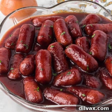 Crockpot Lil Smokies in a bowl with toothpicks and a napkin.