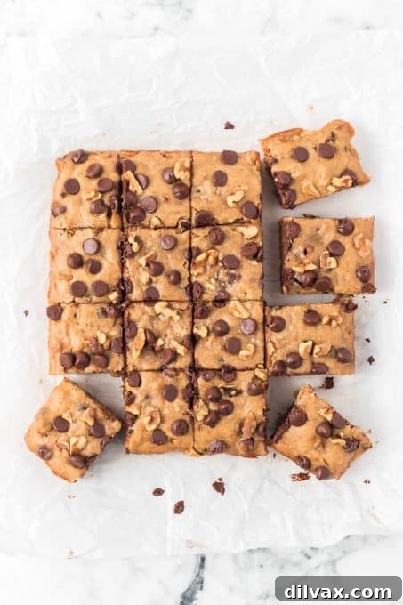 A serving of chewy Banana Blondies with melted chocolate chips.