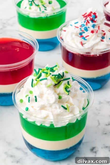Whipped cream and sprinkles on jello desserts.