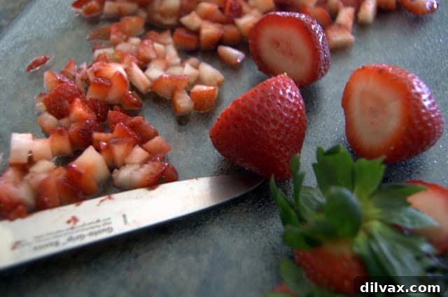 Deliciously frosted Strawberry Lemonade Cupcakes ready to be served on a white platter