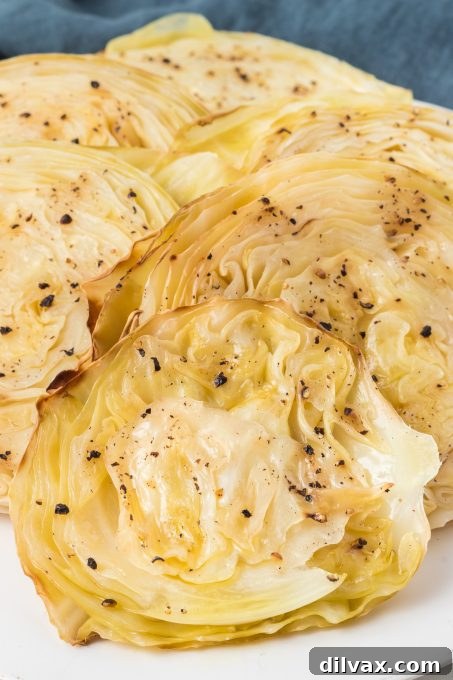 Crispy Roasted Cabbage Steaks 3 Close-up of perfectly roasted cabbage steaks with a golden-brown crust.