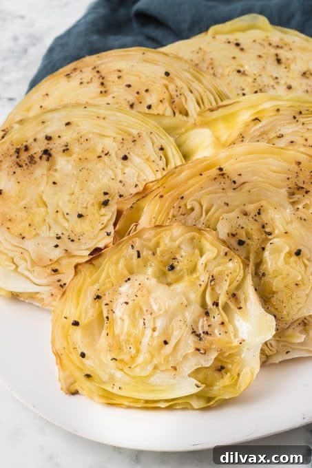 Crispy Roasted Cabbage Steaks 8 Several perfectly roasted cabbage steaks arranged on a large serving platter.