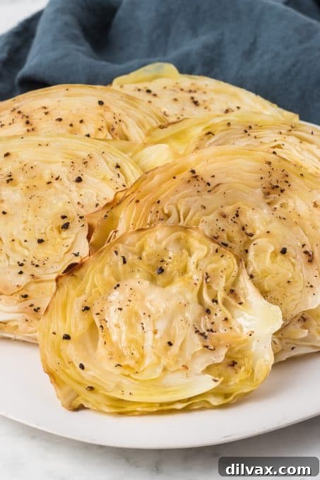 Crispy Roasted Cabbage Steaks 9 Freshly cut, uncooked slices of green cabbage, ready for roasting.