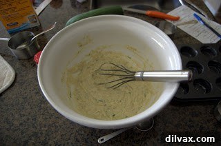 Preparing Zucchini Bites batter in a bowl, showing the combined wet and dry ingredients