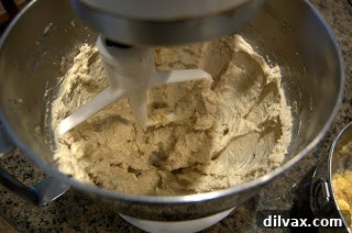 Creaming butter, honey, and brown sugar in a mixing bowl