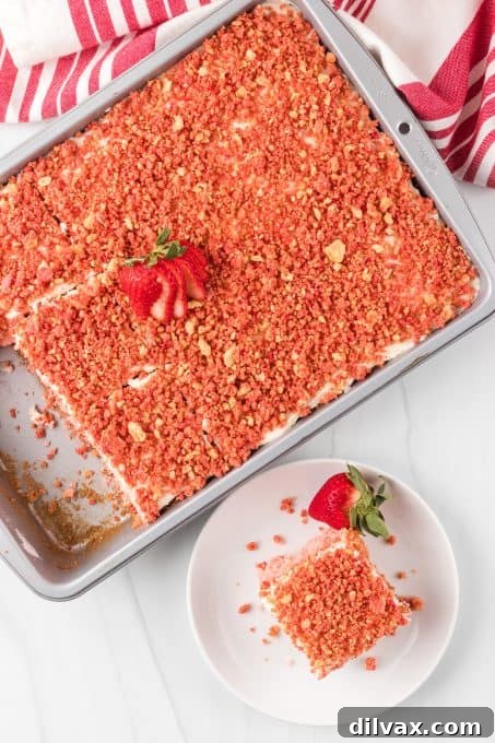 Divine Strawberry Crunch Cake 11 The top of a decorated strawberry cake.