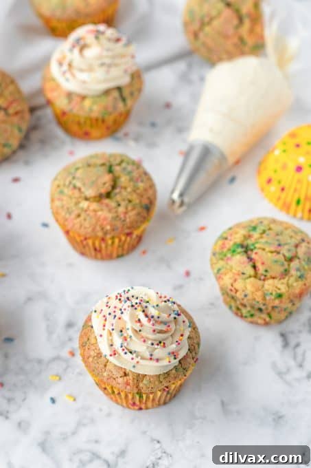 Frosting and cupcakes with sprinkles.
