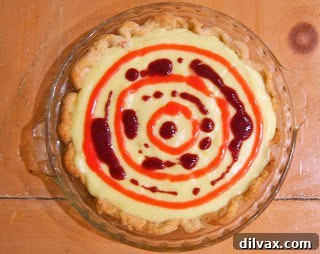 Patriotic Vanilla Berry Pie 7 Blueberry purée being applied in a circle on the pie