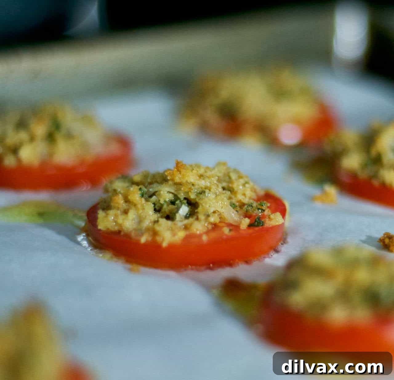 Delicious Crumby Tomatoes, sliced and topped with a savory mixture