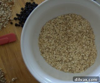 Bowl of healthy breakfast parfait with fresh fruit, yogurt, and granola.
