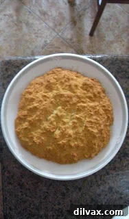 Freshly baked and separated soda biscuits. Several golden-brown soda biscuits, broken into wedges and arranged appealingly, ready for consumption.