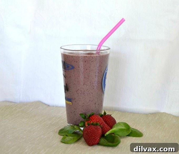 Close-up of a refreshing Easy Fruit Smoothie, highlighting the creamy texture and healthy ingredients like berries, Greek yogurt, and chia seeds.