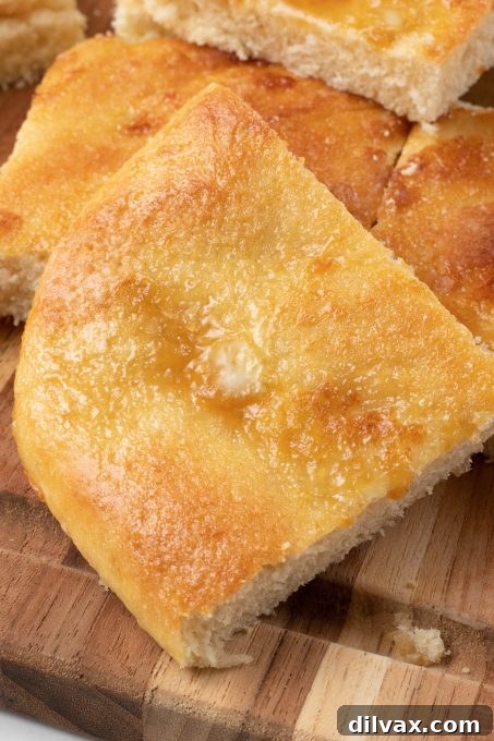 Coca Flatbread 10 A close-up of a Spanish sweet yeast bread, highlighting its beautiful golden crust.