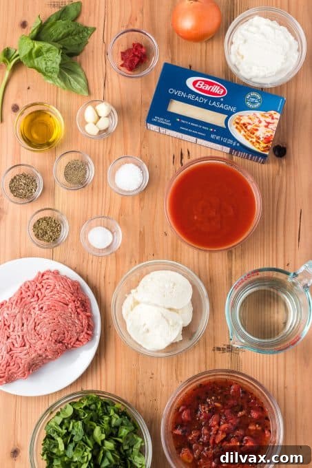 Ingredients for Skillet Spinach Lasagna, laid out on a table.