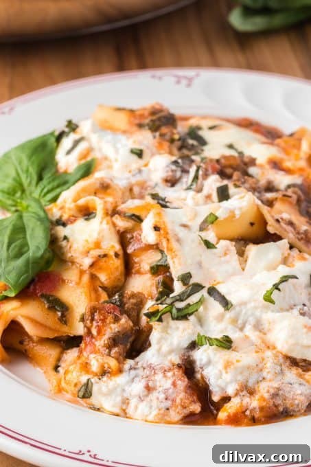 Skillet lasagna made with spinach and fresh mozzarella cheese, served family style.