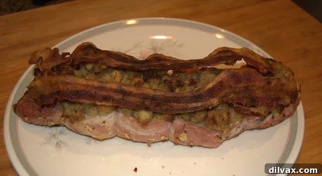 A perfectly roasted pork tenderloin, stuffed with savory onion dressing and topped with crispy bacon.