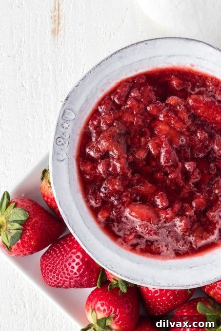 Easy Strawberry Sauce in a white bowl.