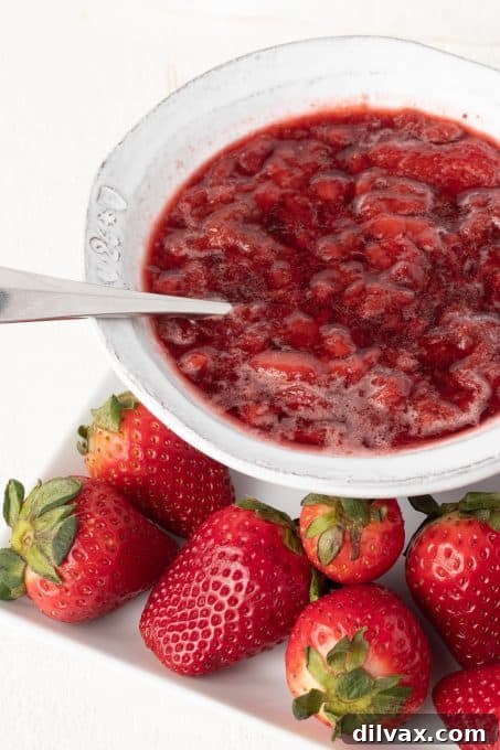 A strawberry sauce made with only 3 ingredients, served in a glass bowl.