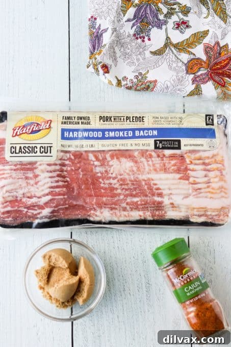 Ingredients laid out for making Cajun Candied Bacon, including bacon, brown sugar, and Cajun seasoning.