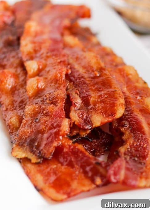 Close-up of crispy Cajun candied bacon, highlighting its texture and seasoning.